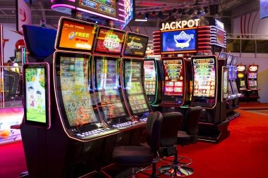 Live blackjack table on mobile phone with EuroLeague match displayed in background